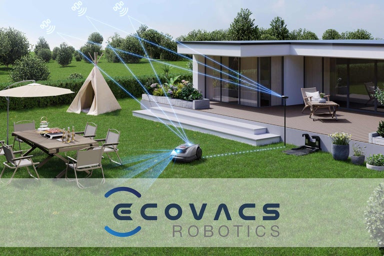 Scene met robotmaaier, tuinmeubelen, speeltent en huis