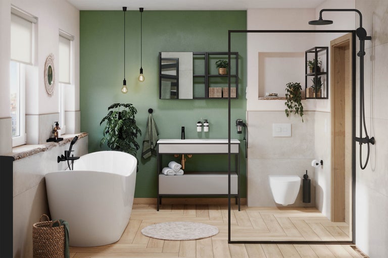 Badkamer met vrijstaand bad, wastafel, douche en toilet in een lichte en vriendelijke sfeer