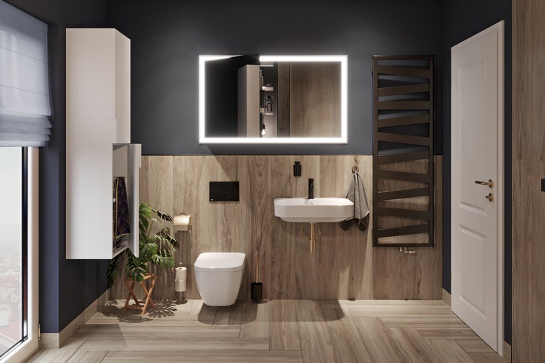 Moderne badkamer met wastafel, spiegel met verlichting, handdoekradiator en bijpassende meubels.