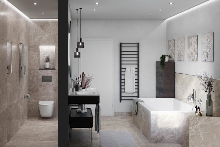 Lichte badkamer met bad, wastafel, toilet en radiator