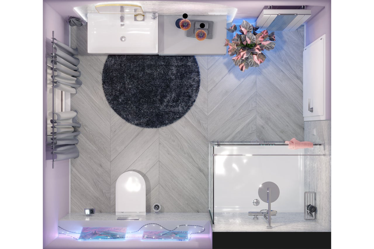 Badkamer bovenaanzicht met wastafel, toilet, bad, vloerkleed en decoratie
