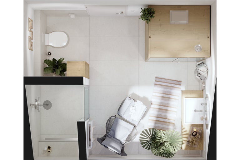 Bovenaanzicht van een lichte badkamer met douche, toilet, wastafel, stoel, vloerkleed en planten