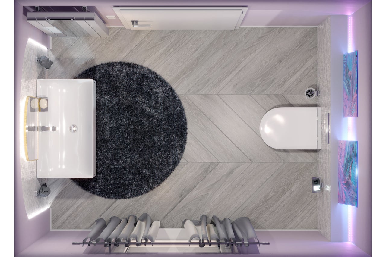 Bovenaanzicht van een badkamer met wastafel, toilet, vloerkleed en handdoekradiator