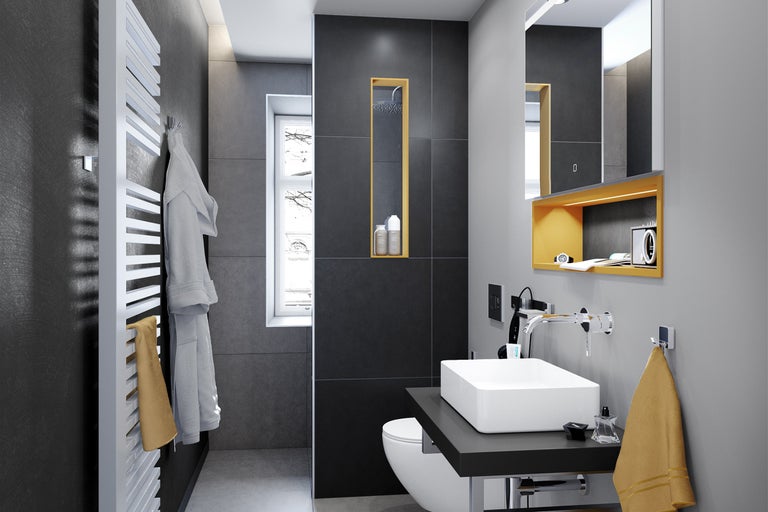 Moderne badkamer met wastafel, toilet, handdoekradiator en spiegel