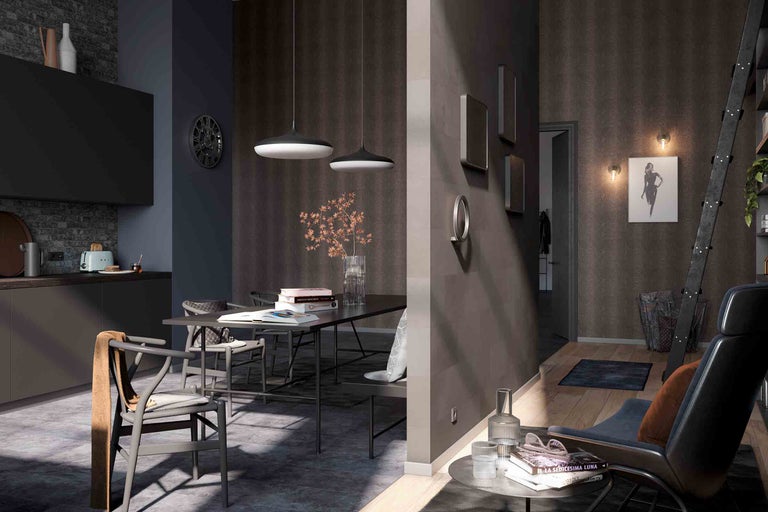 Woonkamer met eettafel, stoelen, hanglampen en decoratieve elementen