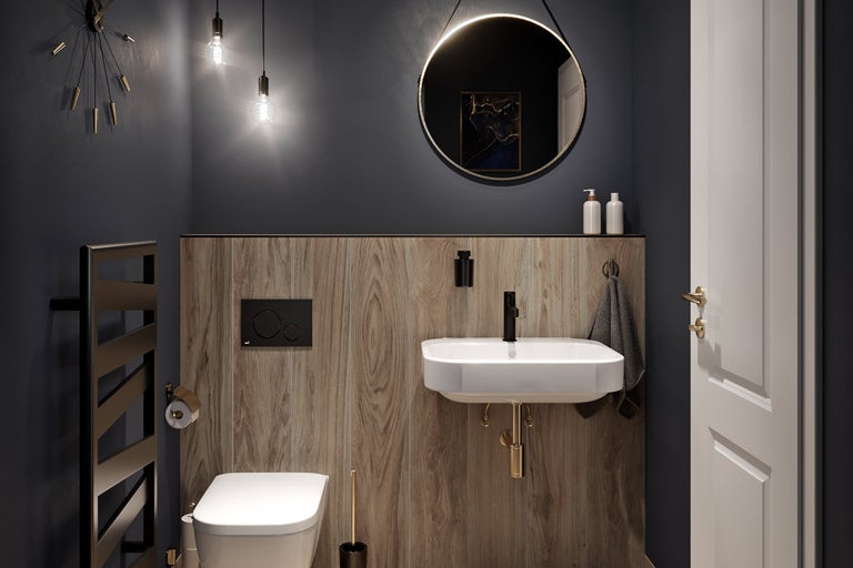 Moderne badkamer met toilet, wastafel, spiegel en radiator