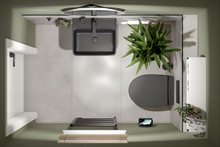 Bovenaanzicht van een badkamer met wastafel, toilet, handdoekradiator en planten