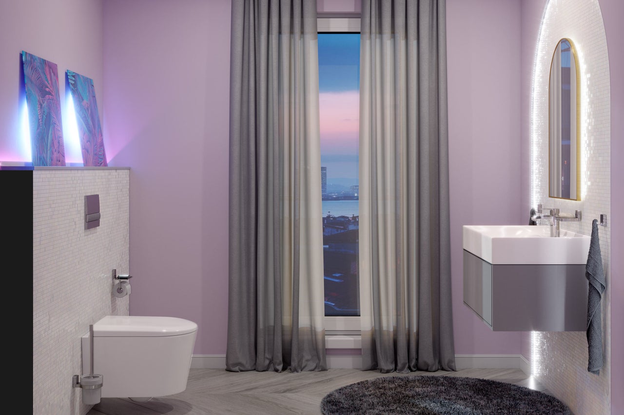 Moderne badkamer met toilet, wastafel en spiegel