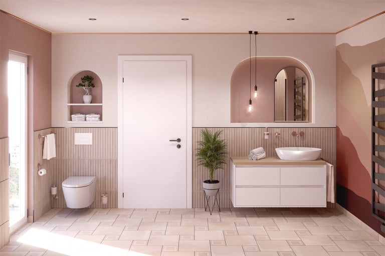 Moderne badkamer met toilet, wastafel, spiegel en radiator.