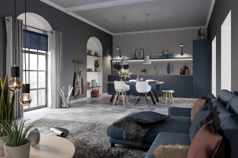 Woonkamer met bank, eettafel en kitchenette in modern design.