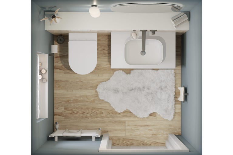 Bovenaanzicht van een badkamer met toilet, wastafel, bad en badmat