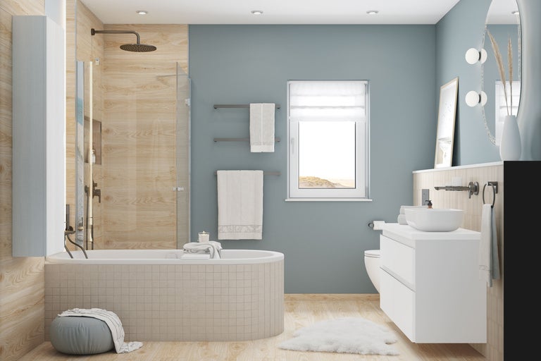 Moderne badkamer met bad, douche, wit wastafelmeubel en wandtegels in lichte houtlook.