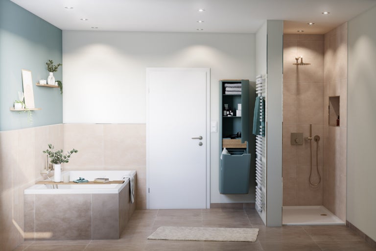 Badkamer met bad, douche, wastafel en handdoekradiator voor een lichte en ruime sfeer