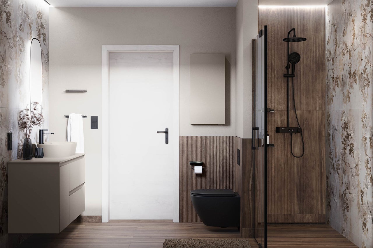 Moderne badkamer met wastafel, toilet en douche.
