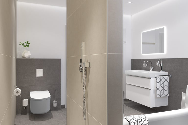 Lichte badkamer met toilet, wastafelonderkast en douche