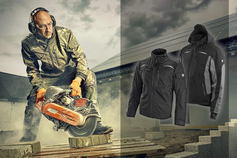 Arbeider met steenzaag, veiligheidskleding en jassen