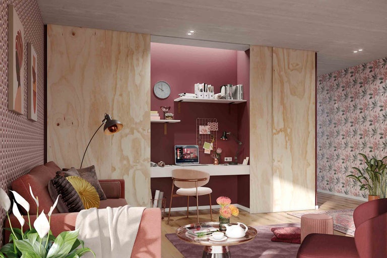Woonkamer met werkplek, bank, tafel en kantoormeubilair in een helder en georganiseerd design.