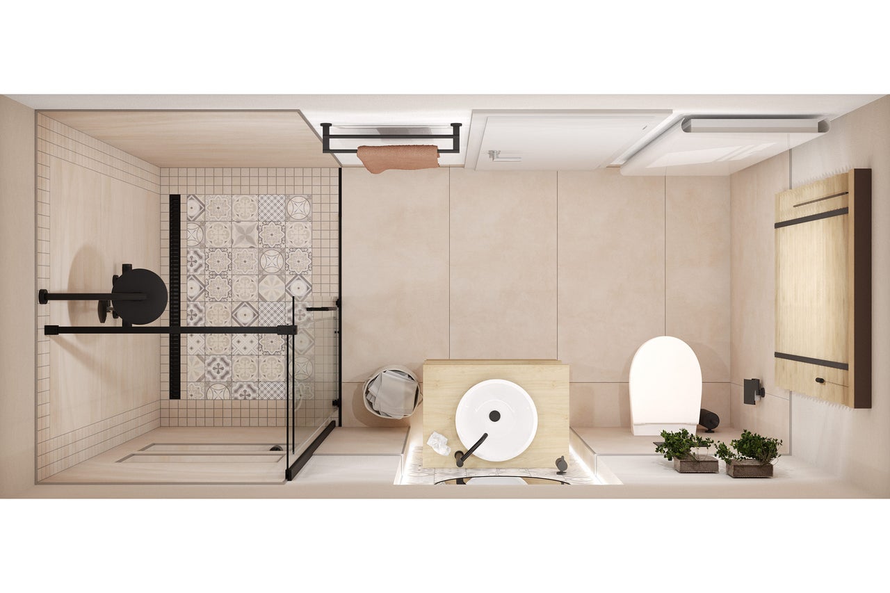 Overzicht van een badkamer met douche, wastafel, toilet en badkamermeubels.