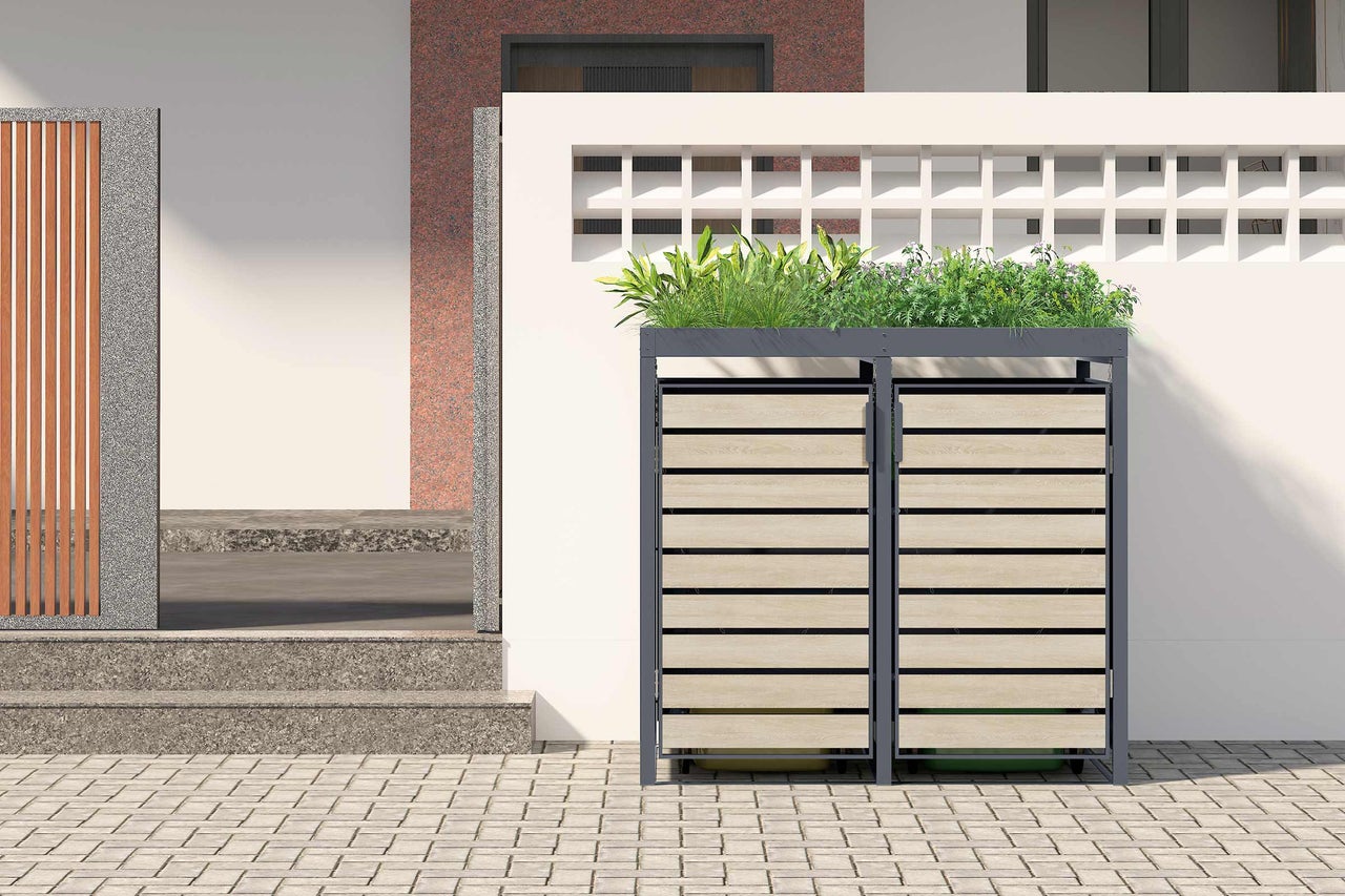 Dubbele afvalcontainerberging met plantenbak voor een huis