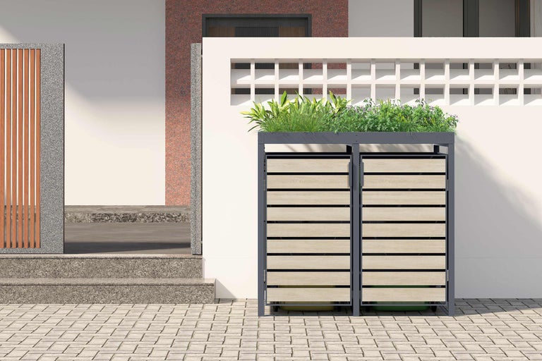 Dubbele afvalcontainerberging met plantenbak voor een huis