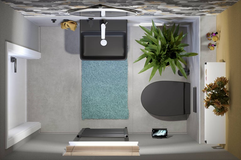 Bovenaanzicht van een badkamer met wastafel, toilet, radiator en decoratie