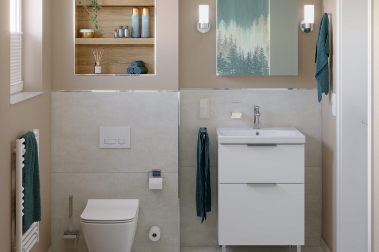 Badkamer met toilet, wastafelonderkast en ingebouwde plank