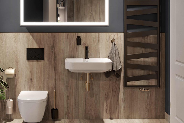 Moderne badkamer met toilet, wastafel, spiegel met verlichting en radiator