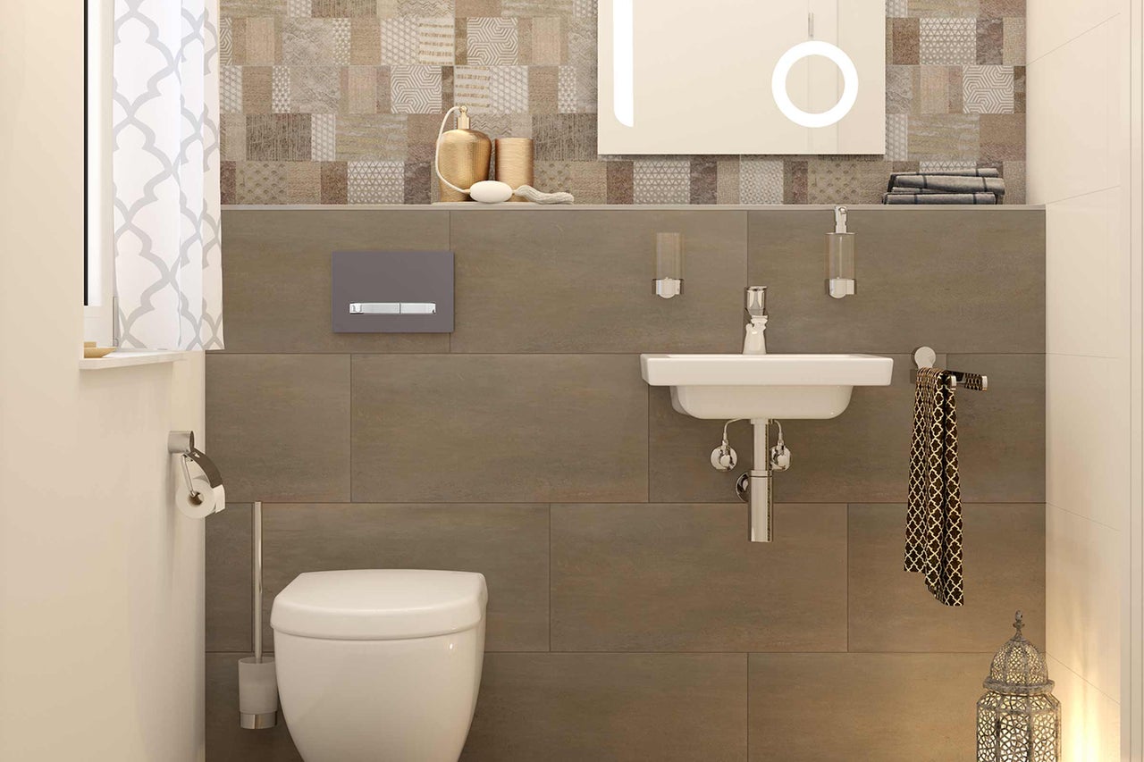 Lichte badkamer met toilet, wastafel en betegelde muur