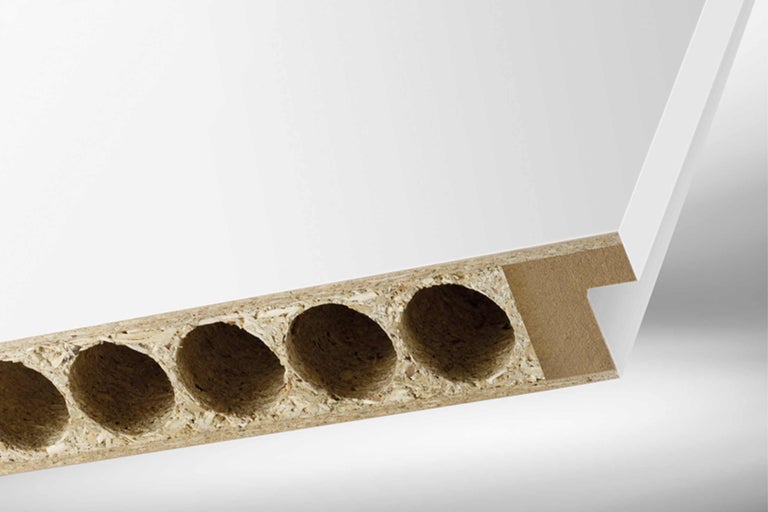 Spaanplaat met boringen en coating