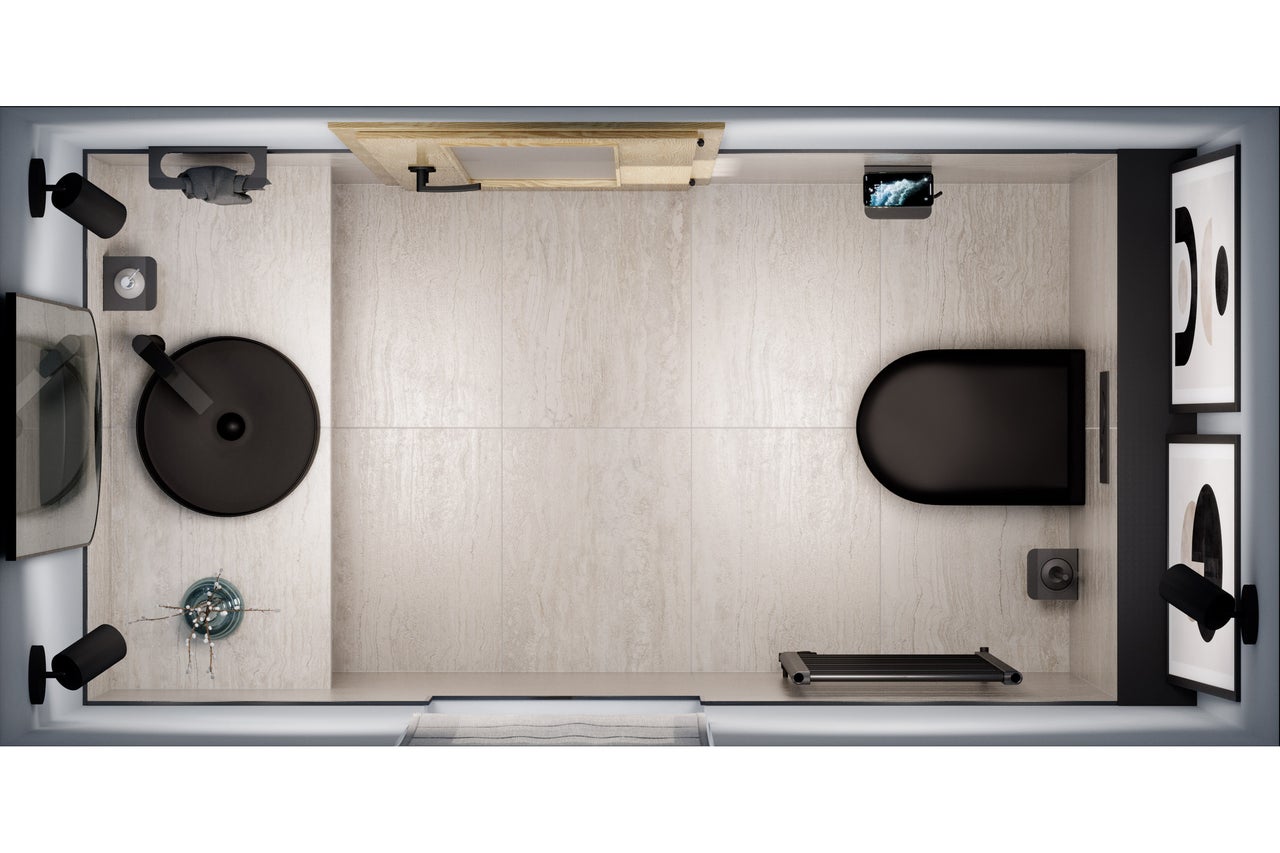 Bovenaanzicht van een heldere badkamer met wastafel, toilet, radiator en decoratie