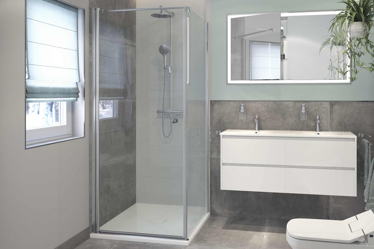 Moderne badkamer met douchecabine, wastafel en verlichte spiegel