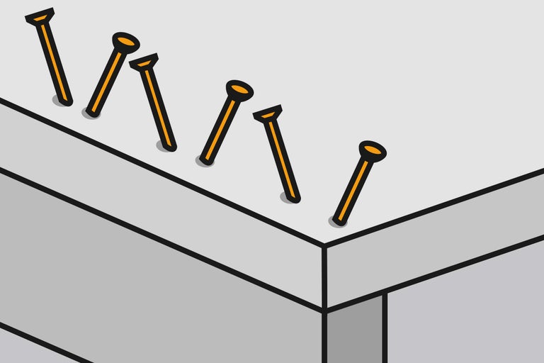 Illustratie van ingeslagen spijkers in hout