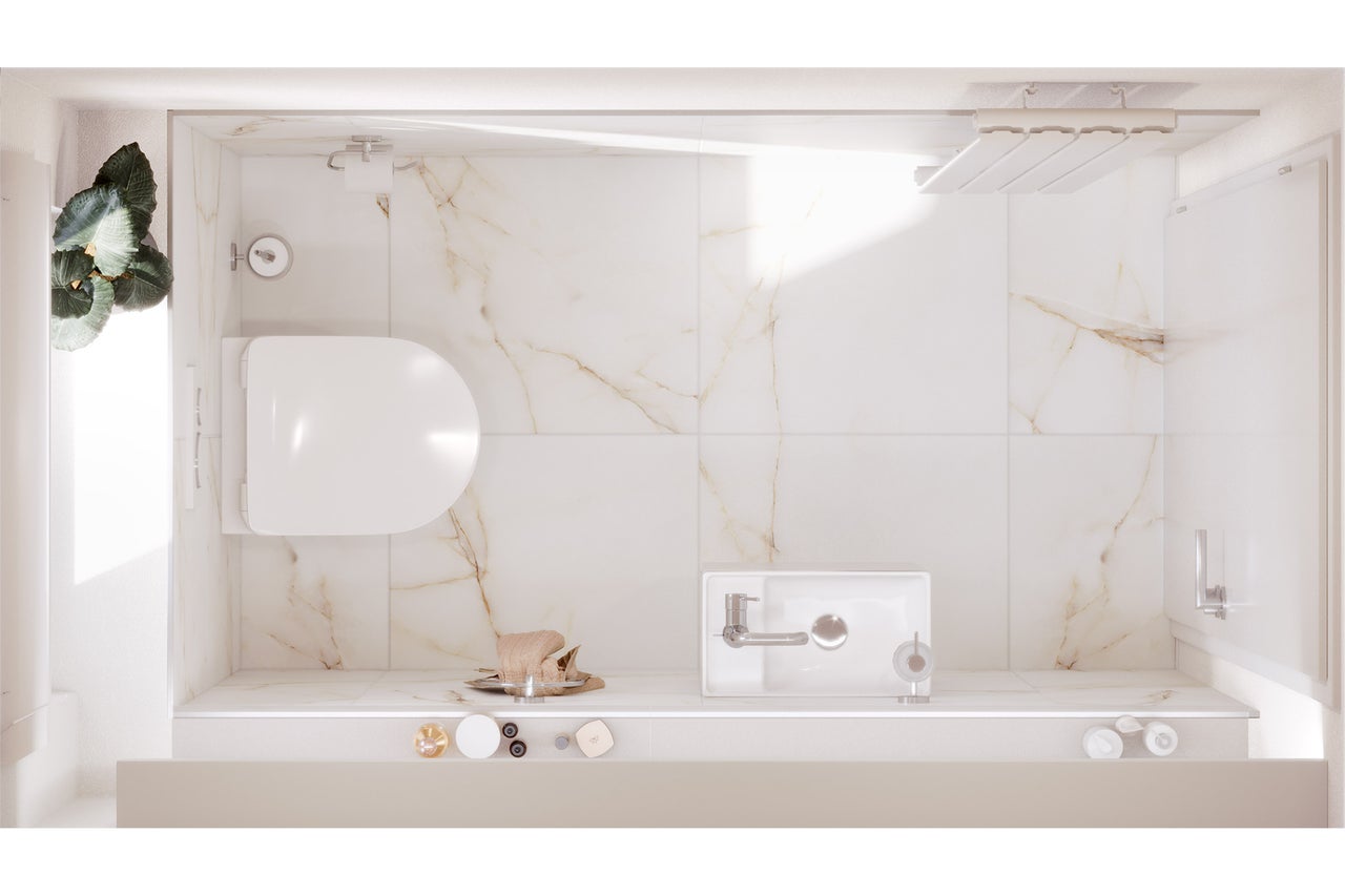 Overzicht van een badkamer met toilet, wastafel en douche