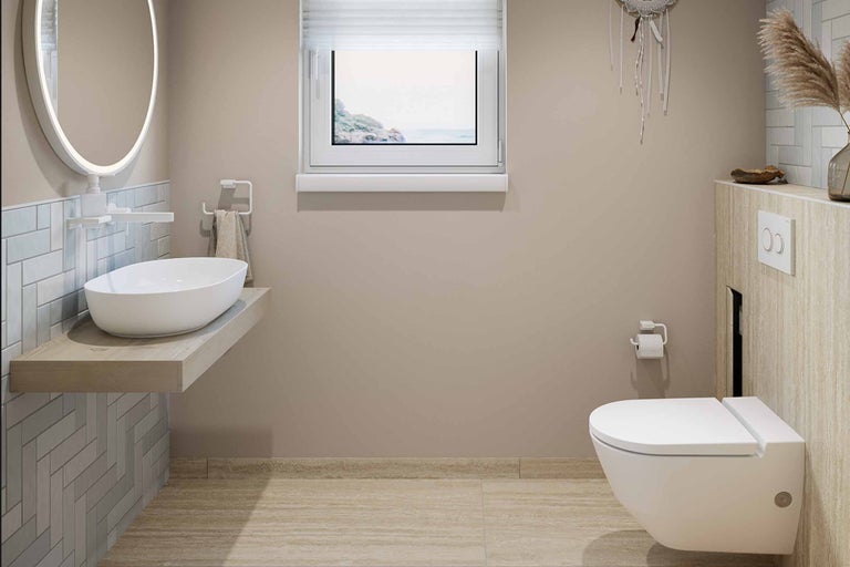 Badkamer met wastafel, spiegel, toilet en raam