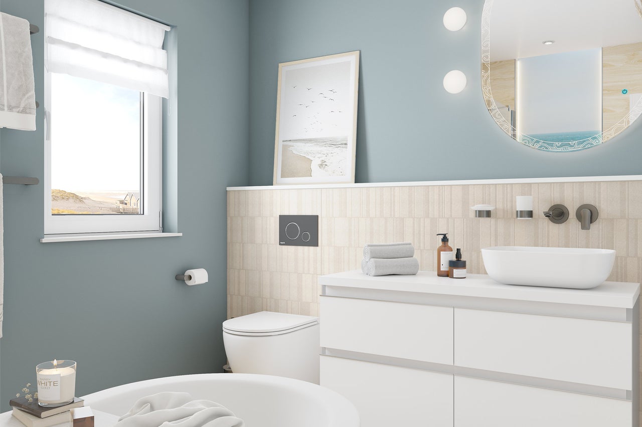 Lichte, moderne badkamer met wastafelmeubel, opzetwastafel, ronde verlichte spiegel, hangend toilet en raam.