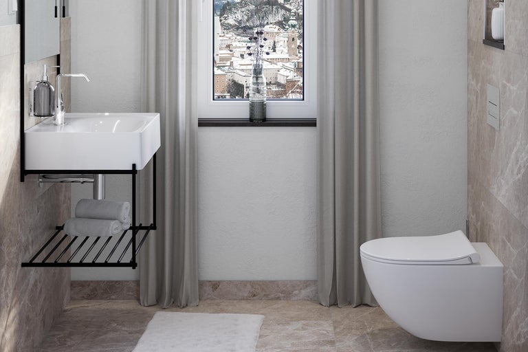 Moderne badkamer met wastafel, toilet en raam