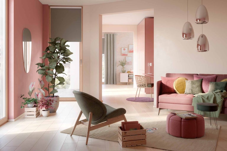 Woonkamer met zitmeubelen, kamerplanten en decoratieve elementen in een helder en georganiseerd ontwerp