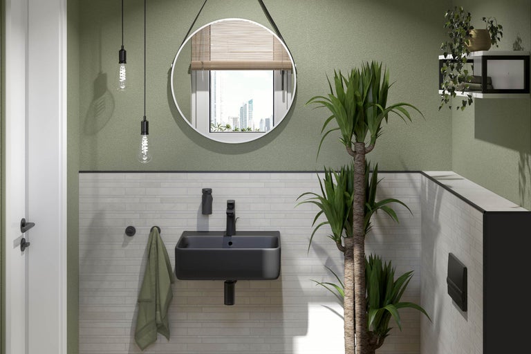 Badkamer met wastafel, spiegel en planten voor een lichte en vriendelijke sfeer