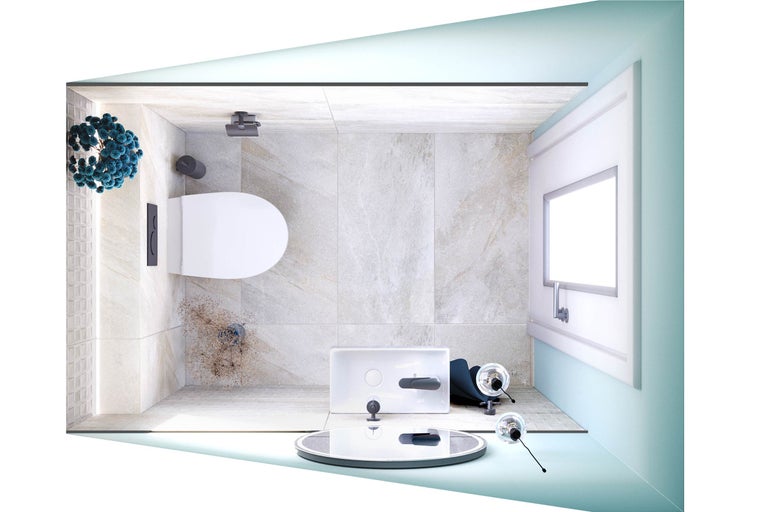 Overzicht van een badkamer met toilet, wastafel en decoratieartikelen