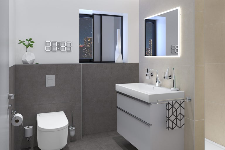 Moderne badkamer met wastafel, toilet en digitale klok