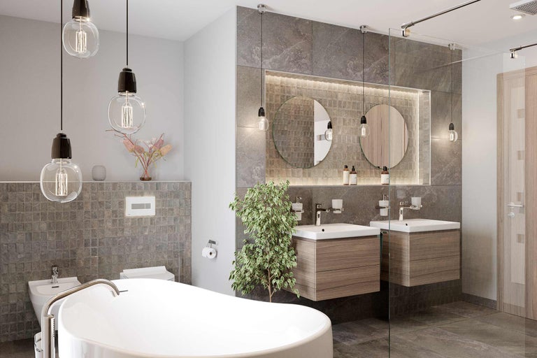 Moderne badkamer met bad, wastafels, spiegels en verlichting