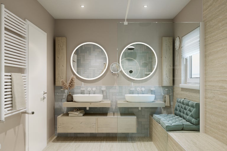 Moderne badkamer met wastafels, ronde spiegels met verlichting, handdoekradiator en zitbank