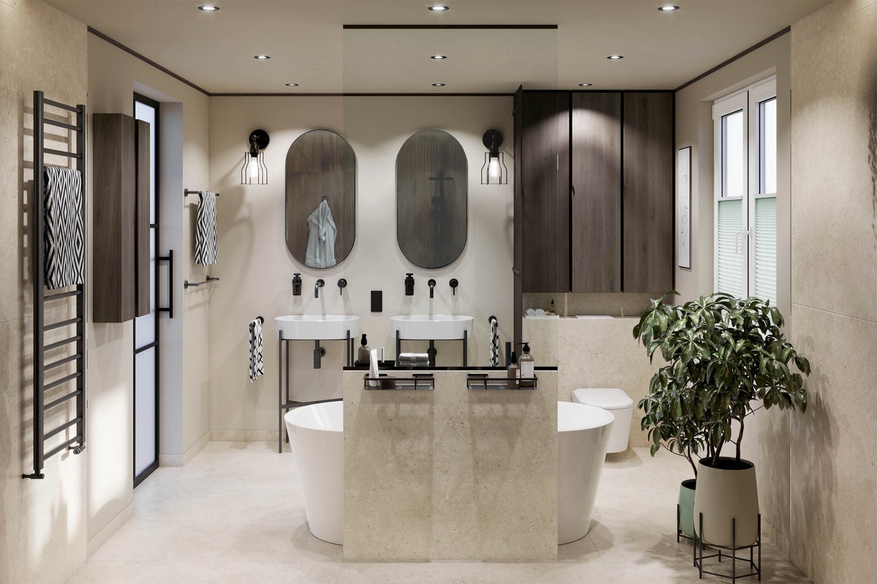 Moderne badkamer met twee ovale spiegels, dubbele wastafel, vrijstaand bad, donkere houten kasten en beige tegels.