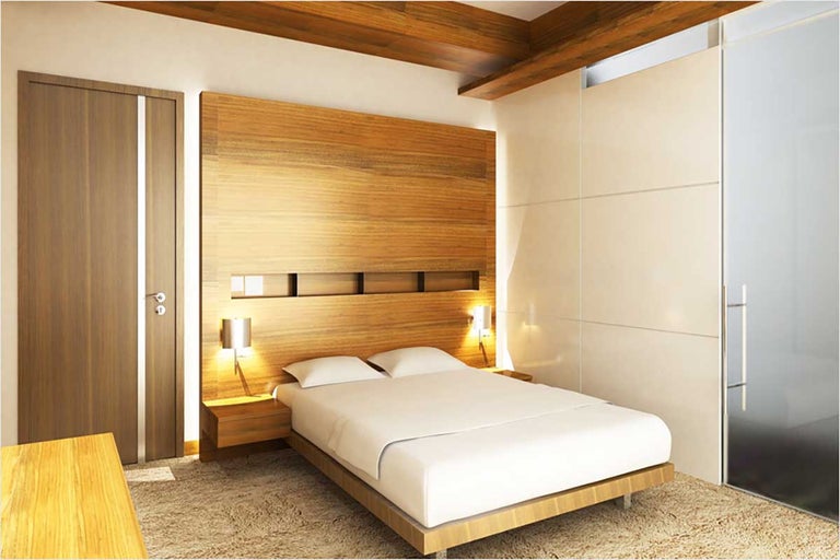 Lichte slaapkamer met houten balken, houten wandpanelen, tweepersoonsbed en nachtkastjes.