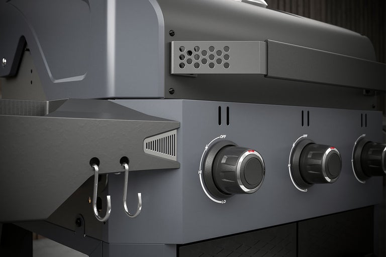 Detailopname van een gasbarbecue met draaiknoppen om de hitte te regelen