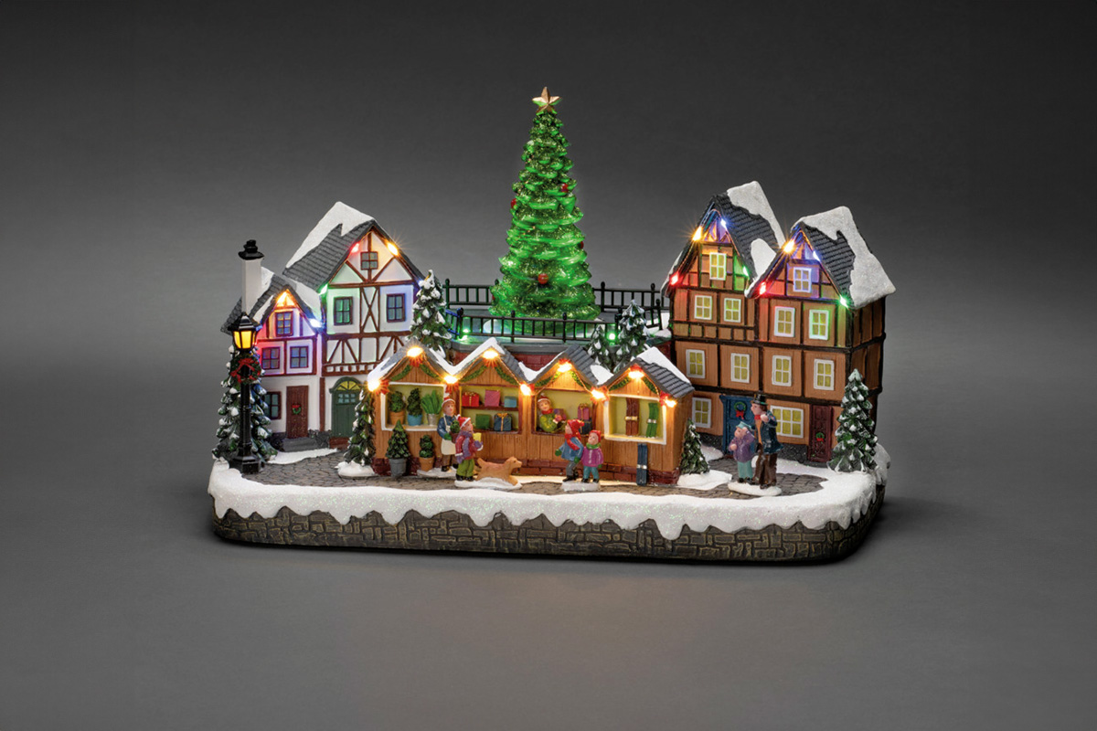 Kerstmarktdorp met verlichte huizen en kerstbomen