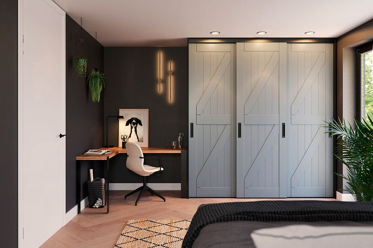 Slaapkamer met schuifdeuren in schuurstijl, bureau en decoraties