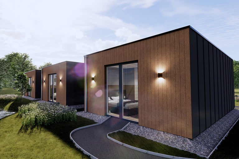 Modulair woonhuis met houten gevel en buitenverlichting