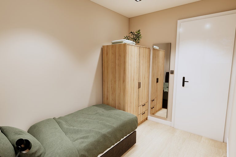 Slaapkamer met bed, kledingkast en spiegel