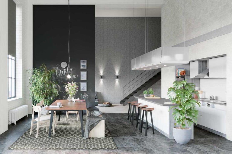 Interieurweergave van een lichte woonkamer met eethoek, keuken en trap